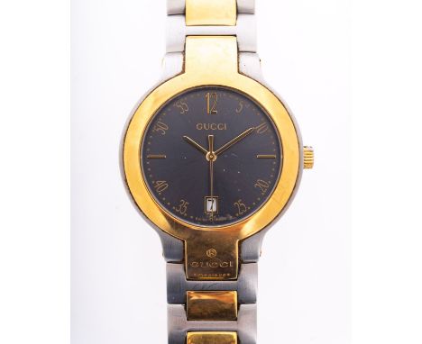 Gucci a lady's stainless steel and gold-plated wristwatch the grey dial with baton and Arabic numerals, baton hands and date 
