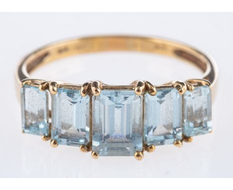 A five stone aquamarine ring, set with graduated step-cut aquamarines, marked 9k, size S, 2.5grams.