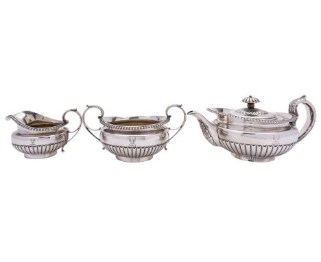 A George IV  three piece silver tea service, maker's mark W.E, London 1821, comprising of a tea pot, milk jug and sugar basin