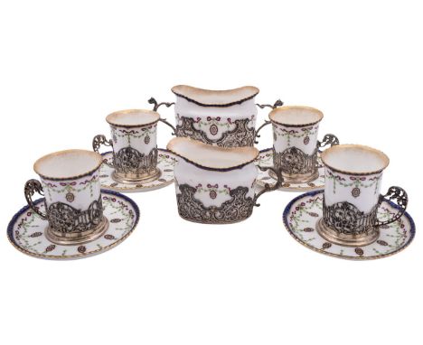 A Royal Worcester coffee service for four with silver mounts by William Comyns & Sons, London 1904 (1 can) , the rest 1910, o