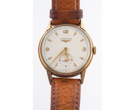 Longines a 9ct gold gentleman's wristwatch the round cream dial signed Longines and having raised baton numerals, dauphine ha