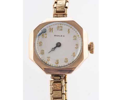 Rolex a 9ct gold lady's wristwatch the round cream dial with raised Arabic numerals and moon hands, the octagonal case stampe