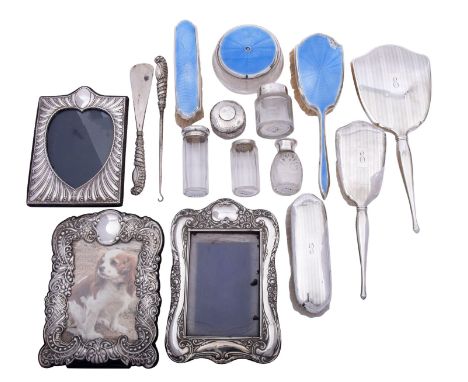 A group of silver items comprising: a cased pair of silver handled shoehorn and button hook, makers mark rubbed, Birmingham 1