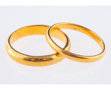 Two 22ct yellow gold wedding bands, both UK hallmarked, sizes M1/2 and M, total gross weight 6.8grams, (2).