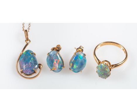 A group of opal jewellery, including a ring set with an oval opal cabochon, Foreign marks, size L, 2.5grams; a pendant set wi