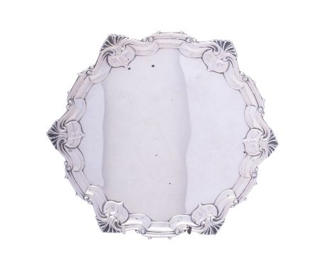 An Edward VII silver salver by William Hutton & Son, London 1903, of circular form with shell and scroll rim, pie-crust borde
