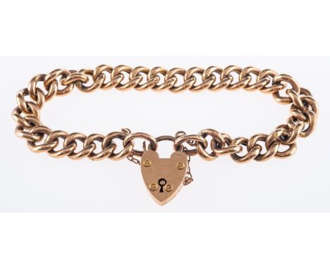 A 9ct yellow gold curb bracelet, with heart padlock and safety chain, marked 9ct, 13.9grams.