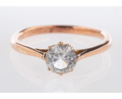 A single stone ring, claw set with a circular-cut white paste stone, unmarked, tests as 9ct gold, size Q1/2, 2.7grams.