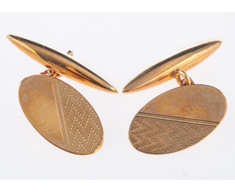 A pair of 9ct yellow gold cufflinks, oval in shape with engine turned engraving, chain links to toggle fitting, UK hallmark, 