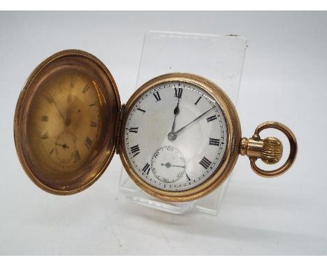 A gold plated, full hunter pocket watch with 15 jewel Lanco movement and Dennison case.