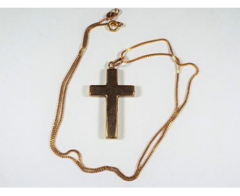 A 9ct gold chain with cross pendant stamped 'C9', approximately 3.6 grams all in.