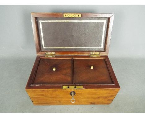 A twin compartment tea caddy of rectangular form, approximately 15 cm x 30 cm x 16 cm.