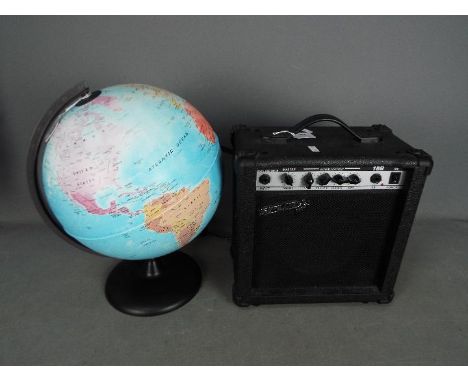 A Spur practice amplifier and an illuminating terrestrial globe, approximately 40 cm (h). [2]