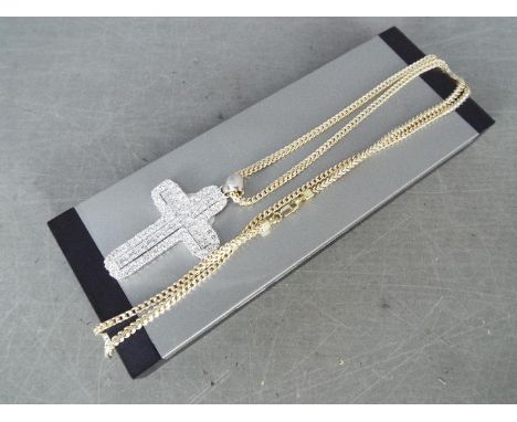 A large silver cross and chain