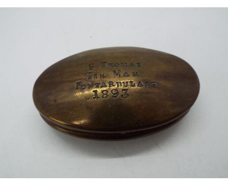 A traditional Welsh brass miner's snuff box, late Victorian, engraved 'S Thomas, Tin Man, Pontardulais, 1893', approximately 