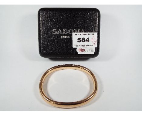 A yellow metal bangle, approximately 19 grams all in (unmarked)All items must be paid for and collected by close of business 