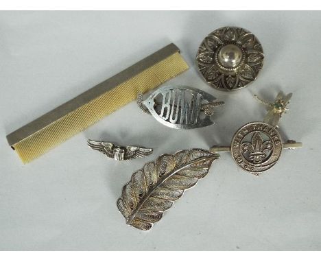 A quantity of silver brooches and a silver comb