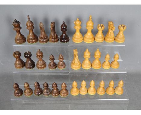 A good quality carved wood chess set with weighted bases and 9.5 cm king.