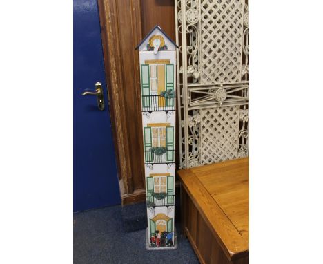 Painted wooden CD rack in the form of a house, with contents, 124cm tall. 