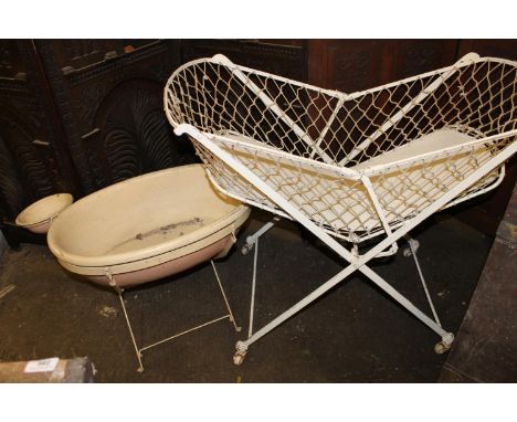 Cream painted metal folding child's cot, and a bath on stand. 