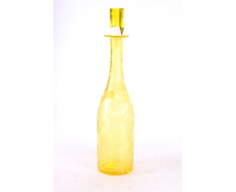 Bohemian yellow glass wine decanter decorated with etched design fruiting grapevine, 35cm high to top of stopper. Stopper is 