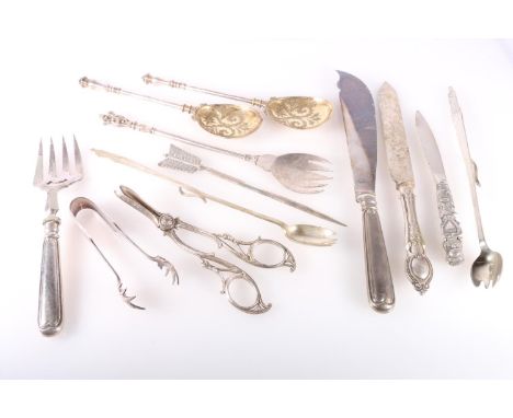 Silver plated flatware to include a pair of serving spoons, carvers, grape scissors, Two George VI Coronation? pickle forks, 