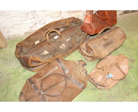 Large vintage leather holdall, a similar Gladstone type bag, and others. 