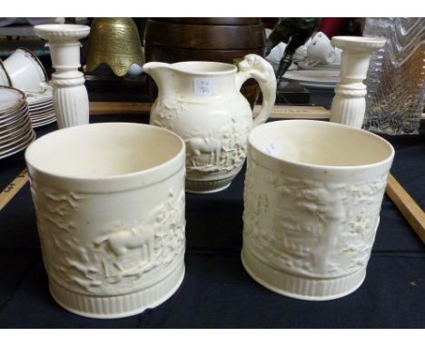 Five pieces of Wedgwood cream ware including hunting jug, candlesticks and plant pots