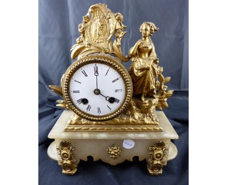 Gilt metal chiming mantle clock on a marble base
