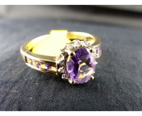 9 ct gold fancy amethyst & diamond ring.