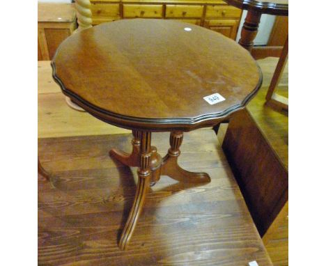 Circular pine crust edged occasion table on a tripod base