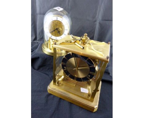 Glass domed anniversary clock and a chiming Schats brass and glass mantle clock