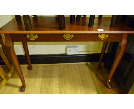 Small mahogany console table on Queen Anne style feet with a small decorative brass handles to front