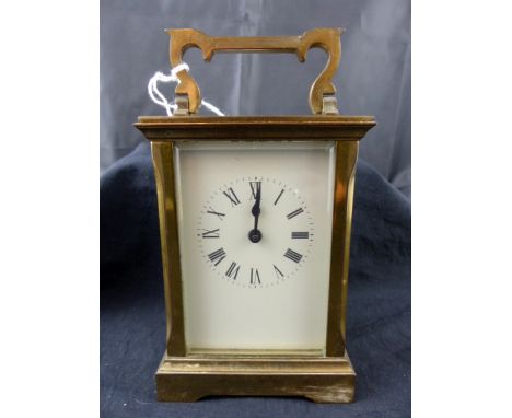 Brass carriage clock with bevelled glass panels. 15 x 8 x 6 cm
