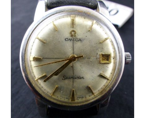 Vintage Omega Seamaster manual wristwatch with Seamaster back on leather strap.