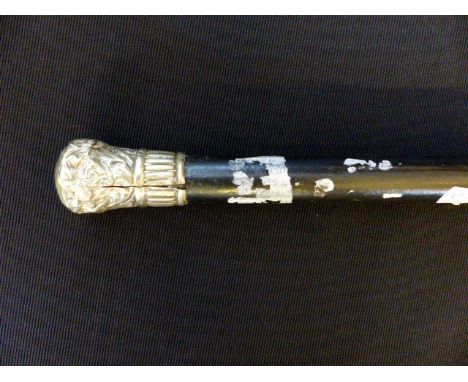 White metal headed ebonised walking stick