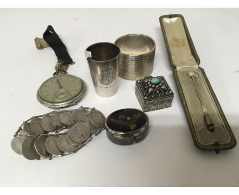 A silver napkin ring pearl stick pin coin bracelet pocket watch and silver beaker (a lot)