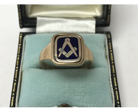 A 9ct gold and blue enamel Masonic spinner signet ring. R. Approx 6.2g.