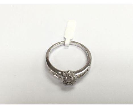 A 9ct white gold multi diamond ring, approx size R and approx 3g.