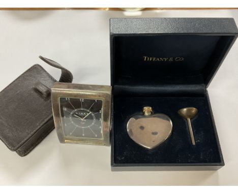 A hallmarked silver Links of London folding travel clock and case together with a Tiffany &amp; Co. Cased perfume bottle and 