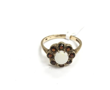 A 9ct gold opal and garnet cluster ring, approx 2.2g and approx size O.