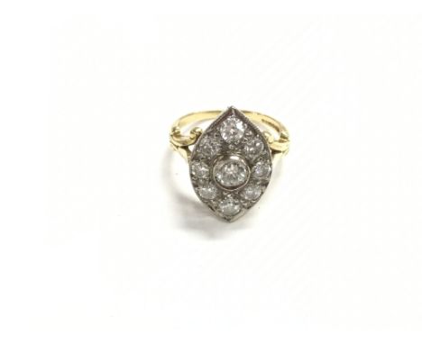 An 18ct gold diamond cluster ring with central stone which is approximately 0.5ct flanked by 8 diamonds which are 0.25 approx