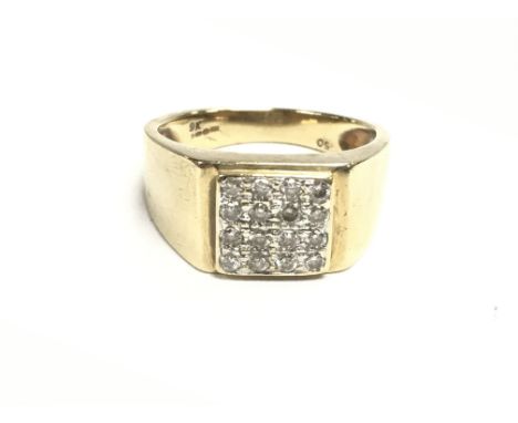 A 9ct gold ring set with a pattern of diamonds approximately 0.5ct. Size T and 6.85g.