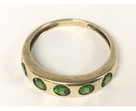 A 9ct ring with a row of gemstones. 2.2g, Q