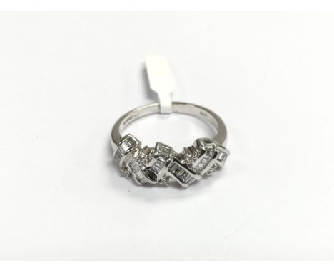 An 18ct white gold modern crossover design ring set with diamonds, approx 4.8g and approx size N.