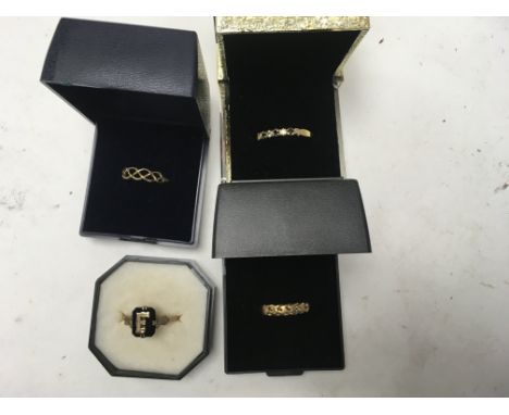 A collection of 9 ct gold rings .
