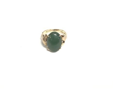 A 14ct gold ring with jade stone. Size L and 5.50g