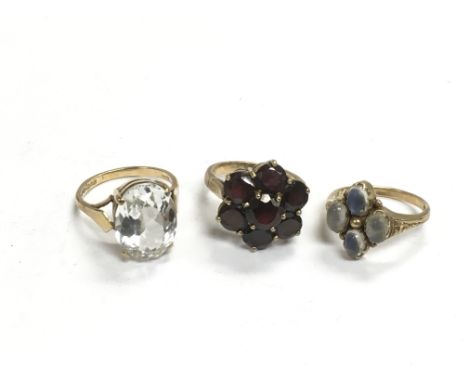 Three 9ct gold rings set with stones, approx total weight 14g.