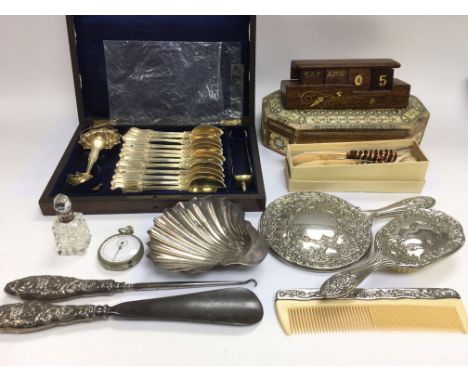 A collection of oddments including a silver dish, silver handled button hook and shoe horn, a cased cutlery set etc.