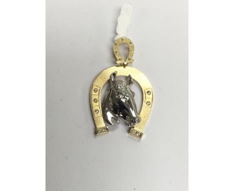 A quality yellow and white gold horseshoe pendant, approx 6.7g.